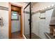 Walk-in shower with tiled walls and mosaic floor at 7925 S Highway 55, Willow Springs, NC 27592