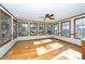 Bright sunroom with hardwood floors and stained glass accents at 7925 S Highway 55, Willow Springs, NC 27592