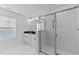 Modern bathroom featuring marble tile, glass shower, and a double sink vanity at 955 Alma Railway Dr # 563, Wake Forest, NC 27587