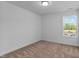 Empty bedroom with a window allowing natural light at 955 Alma Railway Dr # 563, Wake Forest, NC 27587