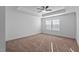 Spacious bedroom featuring a tray ceiling with a ceiling fan and a window with natural light at 955 Alma Railway Dr # 563, Wake Forest, NC 27587