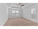 Bright bedroom showcasing a tray ceiling, ceiling fan and a view to the bathroom at 955 Alma Railway Dr # 563, Wake Forest, NC 27587