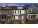 Charming two-story home with a brick facade and inviting red front door at 955 Alma Railway Dr # 563, Wake Forest, NC 27587