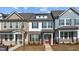 Charming two-story home with a brick facade and inviting red front door at 955 Alma Railway Dr # 563, Wake Forest, NC 27587