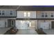Townhomes feature garages, covered patios, and neutral color schemes for a modern look at 955 Alma Railway Dr # 563, Wake Forest, NC 27587