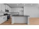 Modern kitchen featuring white cabinets, granite countertops, and stainless steel appliances at 955 Alma Railway Dr # 563, Wake Forest, NC 27587
