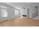 Living room featuring hardwood floors, a modern fireplace and lots of natural light at 955 Alma Railway Dr # 563, Wake Forest, NC 27587