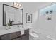 Modern bathroom with marble countertops, soaking tub and tiled walls at 10 Seawell Ave # 102, Raleigh, NC 27601