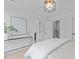 Bedroom featuring modern decor, natural light, and bright white walls at 10 Seawell Ave # 102, Raleigh, NC 27601