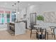 Stylish kitchen featuring a large island with seating, stainless appliances, and a breakfast nook at 10 Seawell Ave # 102, Raleigh, NC 27601