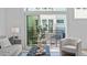 Comfortable living room showcasing modern decor, stylish seating, and a balcony with outdoor furniture at 10 Seawell Ave # 102, Raleigh, NC 27601