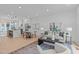Open-concept living room and kitchen featuring modern decor and hardwood floors at 10 Seawell Ave # 102, Raleigh, NC 27601