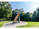 Outdoor sculpture of a metal tree with leaf-shaped ornaments in a park-like setting on a sunny day at 10 Seawell Ave # 102, Raleigh, NC 27601