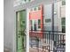 Cozy balcony with seating and views of the adjacent townhomes, perfect for relaxing outdoors at 10 Seawell Ave # 105, Raleigh, NC 27601