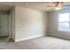 Bedroom boasts neutral carpet, ceiling fan and natural light from the window at 240 Fast Pitch Ln, Four Oaks, NC 27524