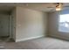 Bedroom boasts neutral carpet, ceiling fan and natural light from the window at 240 Fast Pitch Ln, Four Oaks, NC 27524