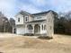 Charming two-story home with a covered porch, spacious two-car garage, and appealing curb appeal at 240 Fast Pitch Ln, Four Oaks, NC 27524
