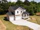 Beautiful two-story home featuring an attached two-car garage and large driveway at 240 Fast Pitch Ln, Four Oaks, NC 27524