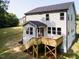 Aerial view of backyard with deck, and new vinyl siding at 266 Fast Pitch Ln, Four Oaks, NC 27524