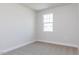 Bright, carpeted bedroom with a window offering natural light and a view of the outdoors at 266 Fast Pitch Ln, Four Oaks, NC 27524