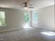 Bright bedroom with 3 windows and a ceiling fan at 266 Fast Pitch Ln, Four Oaks, NC 27524