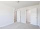 Bedroom with two closets, neutral carpet, and white trim at 266 Fast Pitch Ln, Four Oaks, NC 27524