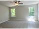Spacious bedroom featuring two large windows at 266 Fast Pitch Ln, Four Oaks, NC 27524