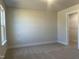 Bedroom with neutral walls, carpet flooring, walk in closet and natural light filled at 266 Fast Pitch Ln, Four Oaks, NC 27524