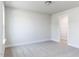 Bedroom with window and a doorway to the walk-in closet at 266 Fast Pitch Ln, Four Oaks, NC 27524