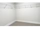 Walk-in closet with wire shelving and neutral carpet at 266 Fast Pitch Ln, Four Oaks, NC 27524