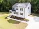 Aerial view of a beautiful two-story home with manicured lawn and a long driveway at 266 Fast Pitch Ln, Four Oaks, NC 27524
