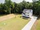Aerial view of a beautiful two-story home with a large manicured lawn at 266 Fast Pitch Ln, Four Oaks, NC 27524