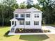 Charming two-story home featuring a well-manicured lawn and a welcoming front porch at 266 Fast Pitch Ln, Four Oaks, NC 27524