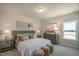 Well-lit bedroom with plush carpet, cozy decor, and neutral paint providing a comfortable atmosphere at 52 Macy Cir, Wendell, NC 27591