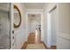Inviting entryway with light walls, wood floors, and decorative mirror at 52 Macy Cir, Wendell, NC 27591