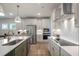 Modern kitchen with stainless steel appliances, stylish cabinets, and recessed lighting at 52 Macy Cir, Wendell, NC 27591