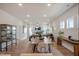 Open-concept living area with a fireplace, dining table, and hardwood floors at 52 Macy Cir, Wendell, NC 27591