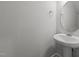 Bathroom with pedestal sink and a round mirror at 951 Alma Railway Dr # 561, Wake Forest, NC 27587