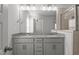 Bathroom with double vanity, grey cabinets, granite counters, and glass shower at 951 Alma Railway Dr # 561, Wake Forest, NC 27587