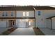 Exterior of townhomes with attached garages and driveways at 951 Alma Railway Dr # 561, Wake Forest, NC 27587