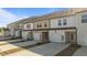 Row of new townhomes with driveways and garages at 951 Alma Railway Dr # 561, Wake Forest, NC 27587