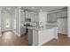 Modern kitchen with gray cabinetry, stainless steel appliances, and granite countertops at 951 Alma Railway Dr # 561, Wake Forest, NC 27587