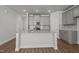 Modern kitchen with gray cabinetry, stainless steel appliances, and granite countertops at 951 Alma Railway Dr # 561, Wake Forest, NC 27587