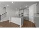 Open-concept kitchen featuring an island, modern appliances, and hardwood flooring at 951 Alma Railway Dr # 561, Wake Forest, NC 27587