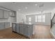 Bright living room with hardwood floors, a modern fireplace, and a ceiling fan at 951 Alma Railway Dr # 561, Wake Forest, NC 27587