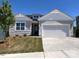Charming one-story home with a well-manicured lawn, attached two-car garage and classic curb appeal at 96 Little Creek Dr, Lillington, NC 27546