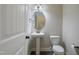 Clean half bathroom with a pedestal sink and classic fixtures at 98 Valley Brook Ln, Spring Lake, NC 28390