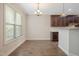 Inviting dining area with hardwood floors, bright window, and stylish chandelier fixture at 98 Valley Brook Ln, Spring Lake, NC 28390