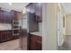 Kitchen with stainless steel appliances, granite countertops, and dark wood cabinetry at 98 Valley Brook Ln, Spring Lake, NC 28390
