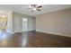 Bright living room with hardwood floors, neutral walls, and a laundry area at 98 Valley Brook Ln, Spring Lake, NC 28390